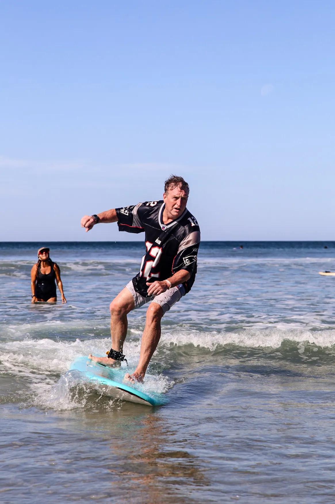 Intensive surf program student riding waves with stable posture in Santa Teresa